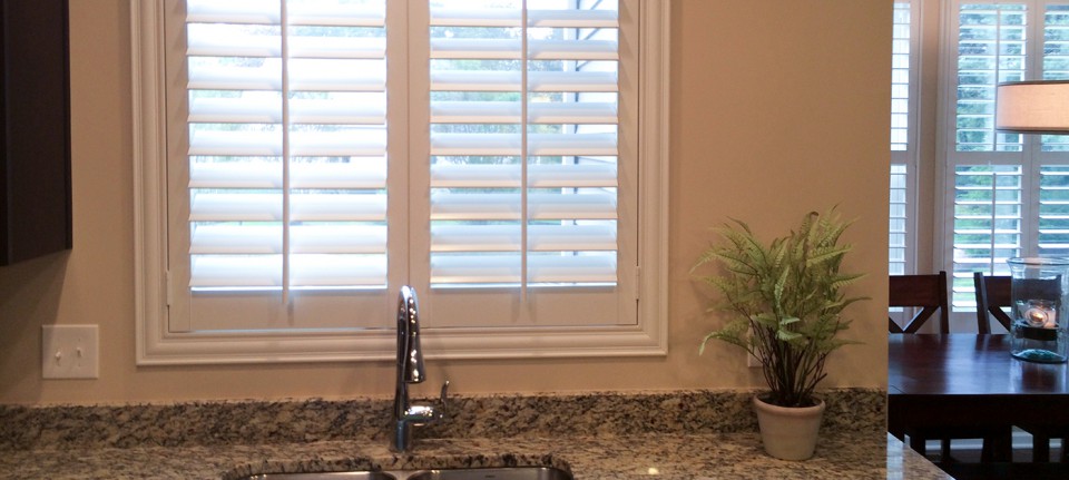 plantation shutters over kitchen sink